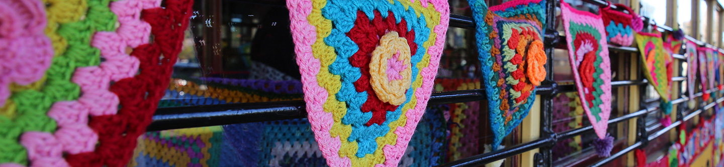 Close up of crochet bunting on the exterior of Bendigo's Yarn Bomb Tram