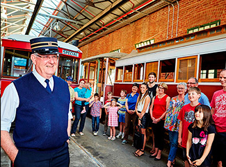 Tram Driver giving a group a tour of the Bendigo Tramways Depot and Workshop